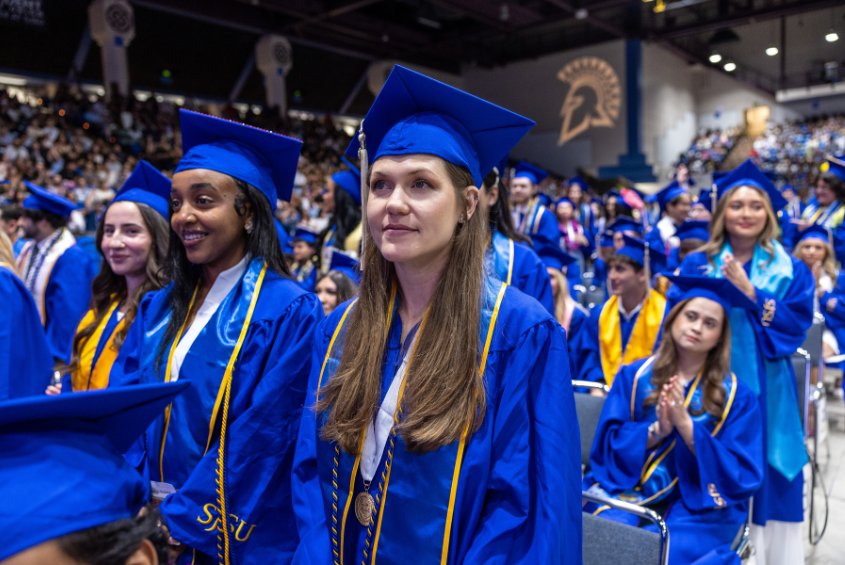 Graduating Spartans in the Event Center at Commencement
