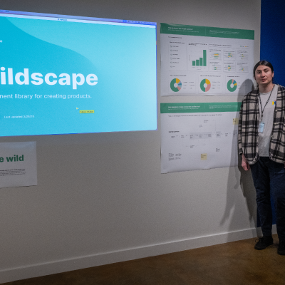 Student Alexis Miller posing with work.