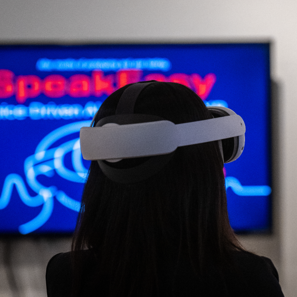 Back of Person wearing VR goggles.