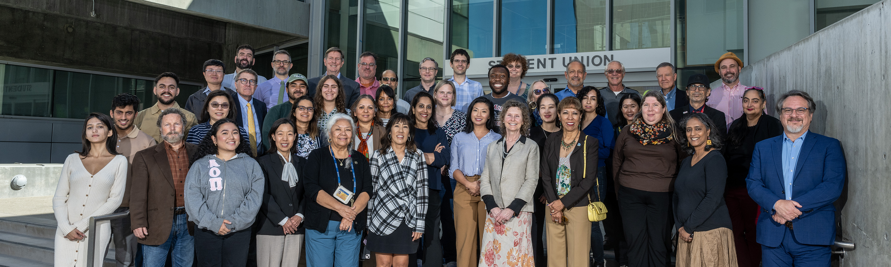 Group of University leadership outside of the student union